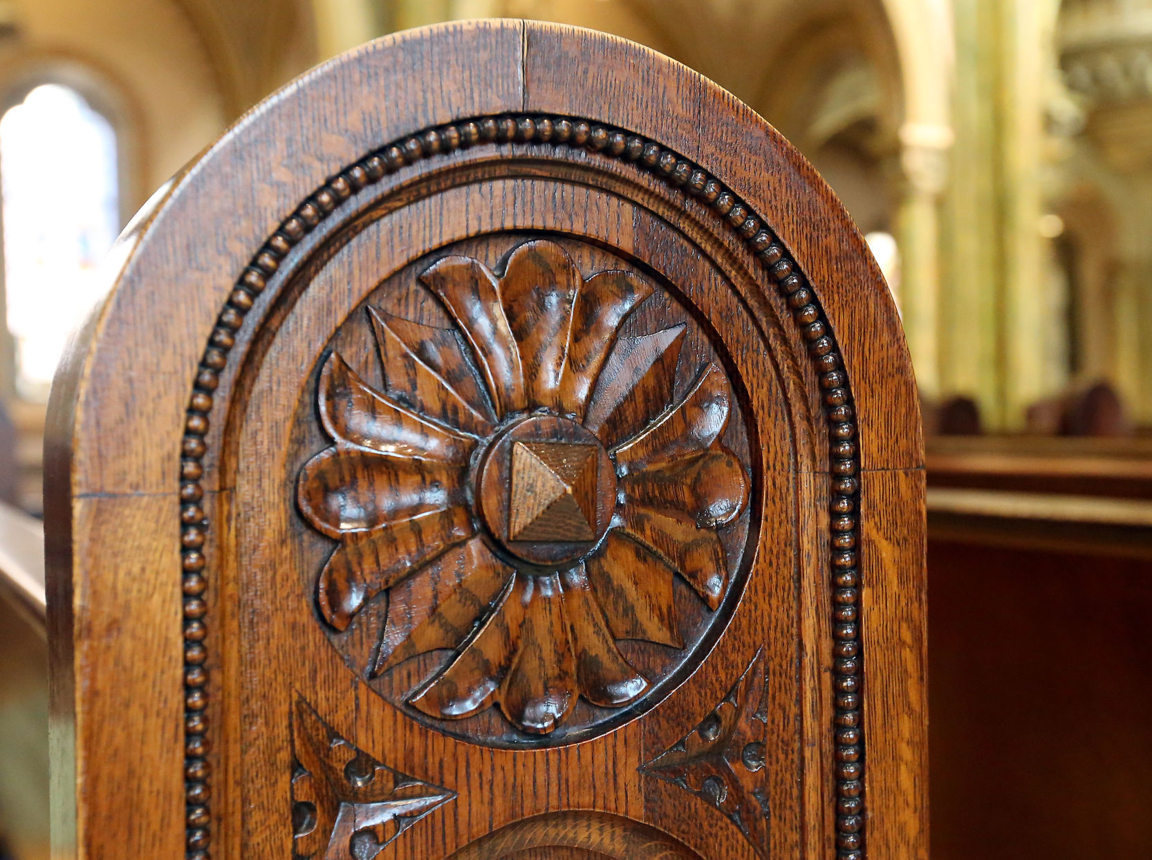 Pew carvings in Mary of the Angels Chapel